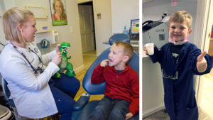 Dr Simpson showing child how to brush teeth and kid dressed as dentist for a day